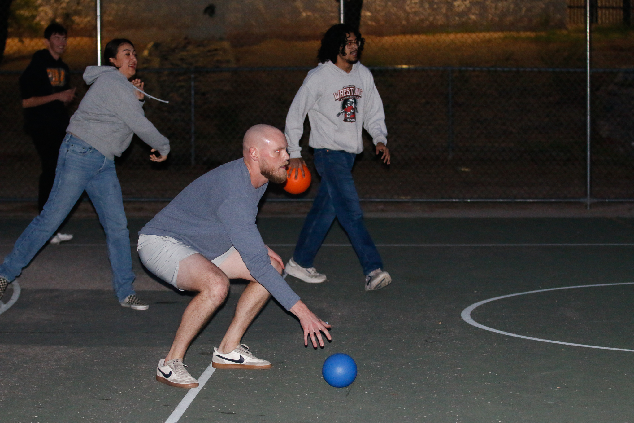 Teachers toss dodgeballs at their students