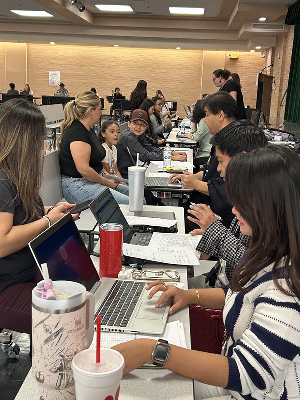 Parents and students in the cafeteria during conferences
